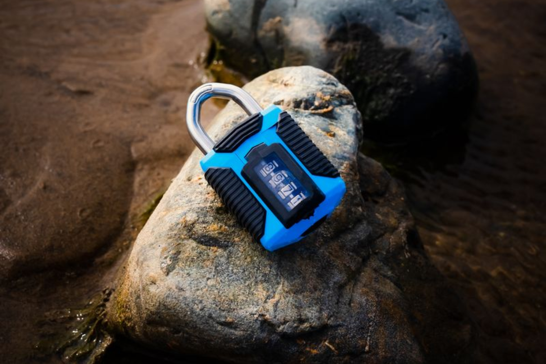 Padlock on a beach rock